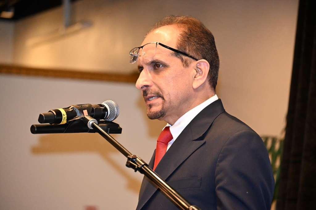 Amir Khan delivering keynote address on stage at GRAVITAS Book Signing Ceremony